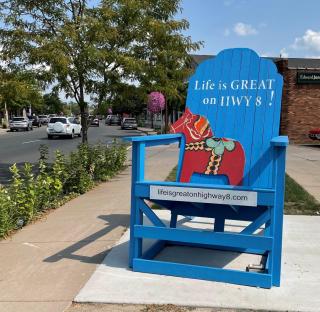 Life is Great on Highway 8- Giant Chair in front of the Chisago Lakes Chamber building